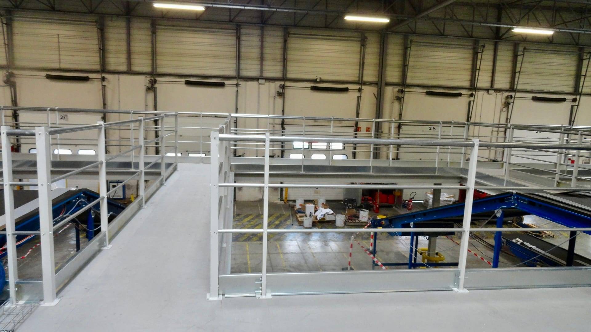 Walkways and mezzanine integrated above conveyor lines in a sorting centre