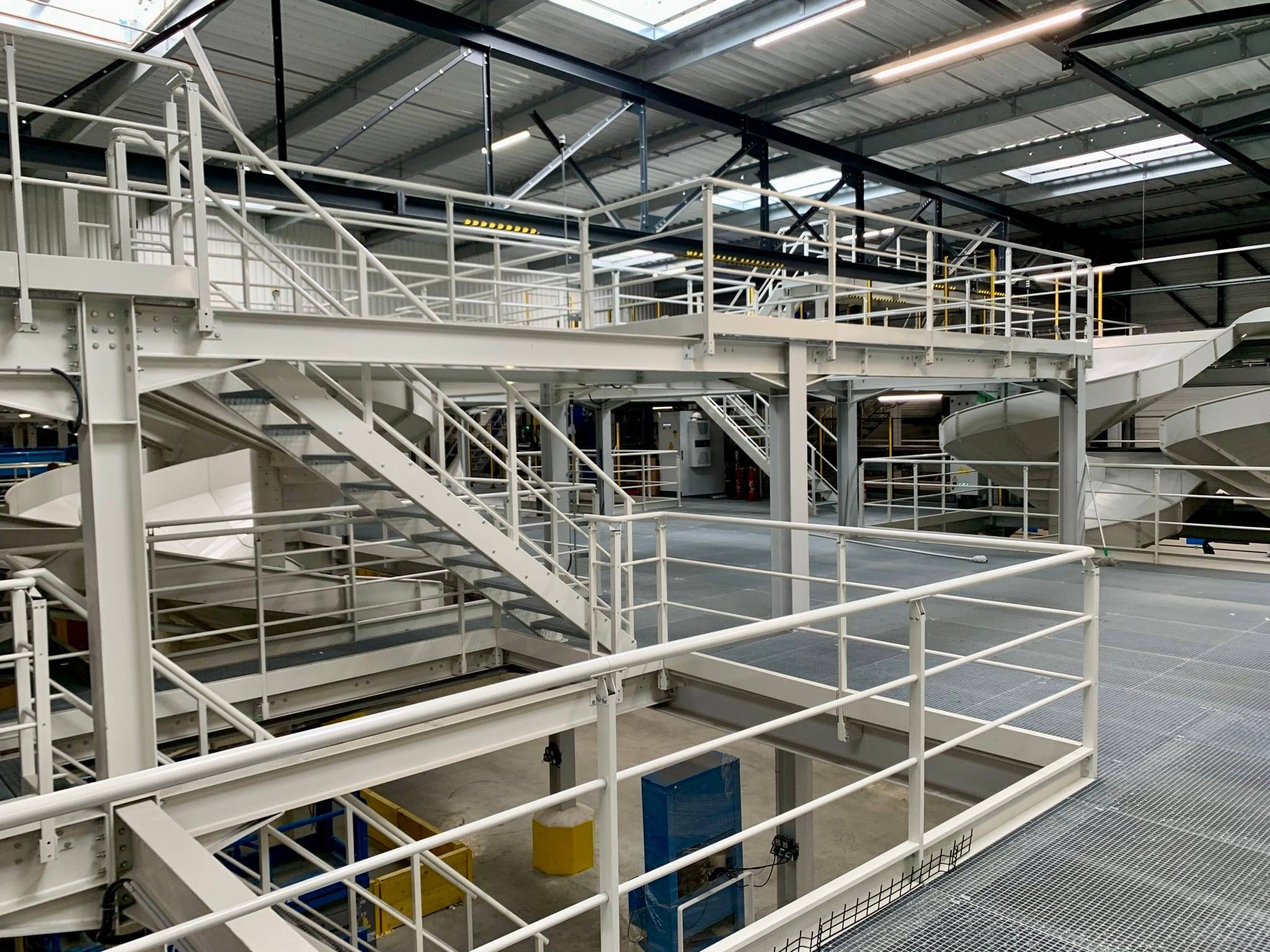 Multi-level grating platform, with levels connected by steel stairs