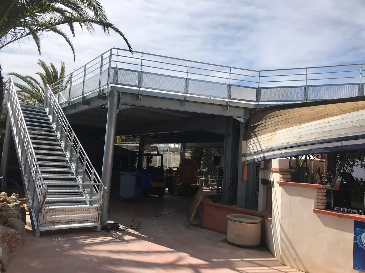Refuge platform with stairs and guardrails in a flood-prone area